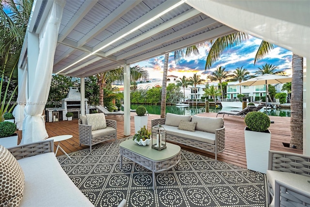 view of patio / terrace featuring a water view and an outdoor hangout area