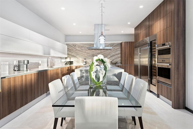 tiled dining room with sink