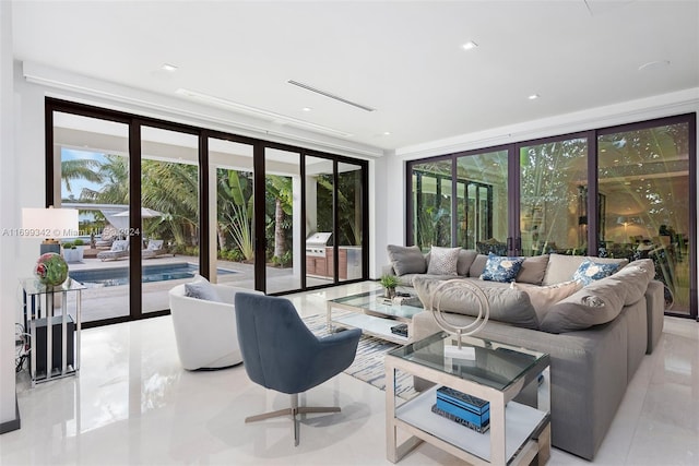 living room featuring french doors and floor to ceiling windows