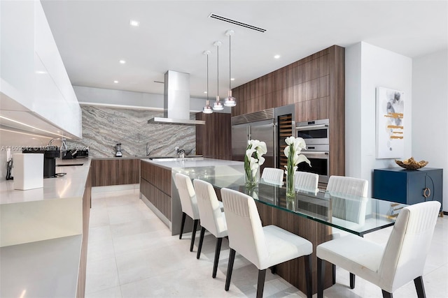 tiled dining space featuring sink