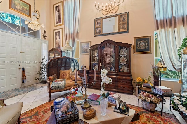 sitting room featuring a notable chandelier and light tile patterned floors