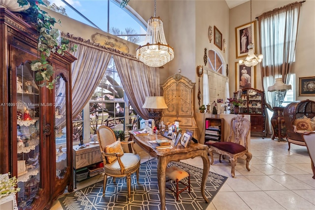 living area featuring a notable chandelier, plenty of natural light, a high ceiling, and light tile patterned floors