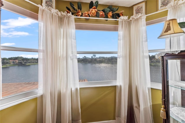 entryway featuring a water view