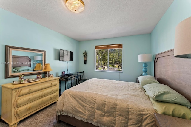 carpeted bedroom with a textured ceiling