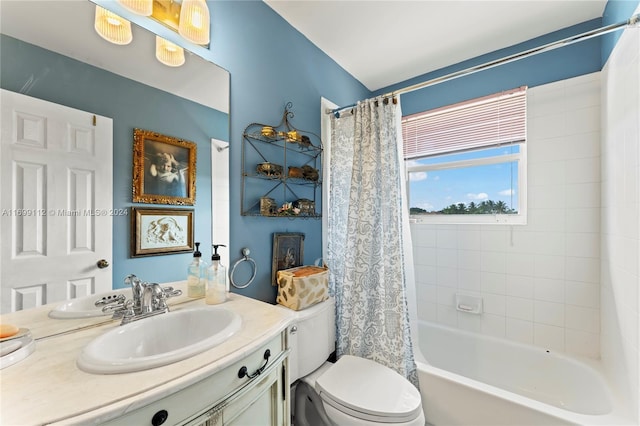 full bathroom featuring shower / bath combo, vanity, and toilet