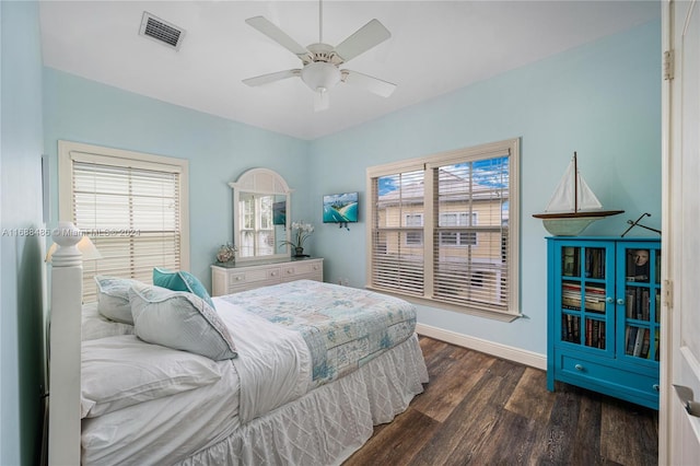 bedroom featuring ceiling fan and dark hardwood / wood-style flooring