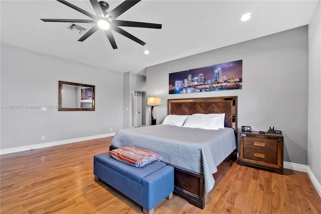 bedroom with hardwood / wood-style floors and ceiling fan