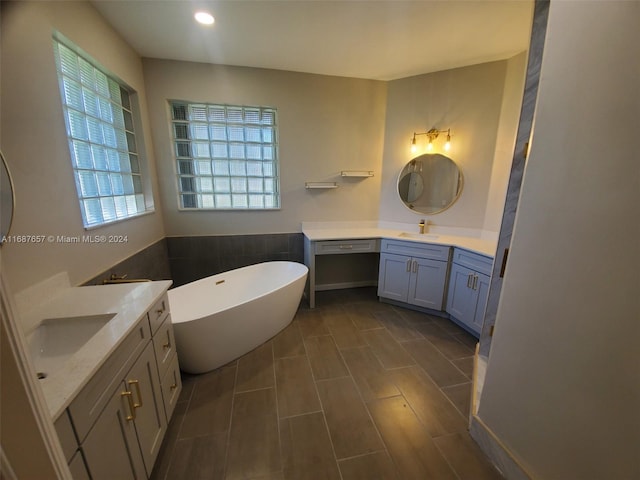 bathroom featuring a bathing tub and vanity