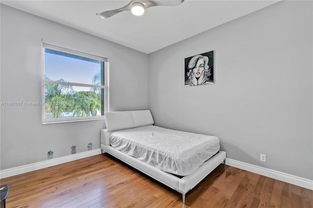 bedroom featuring ceiling fan and wood-type flooring