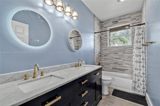 full bathroom with tile patterned flooring, shower / bath combination with curtain, toilet, and vanity