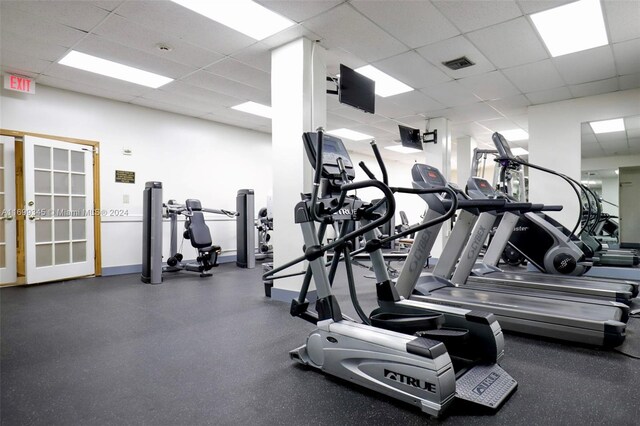 workout area with a paneled ceiling