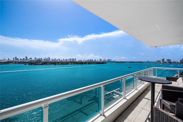 balcony featuring a water view