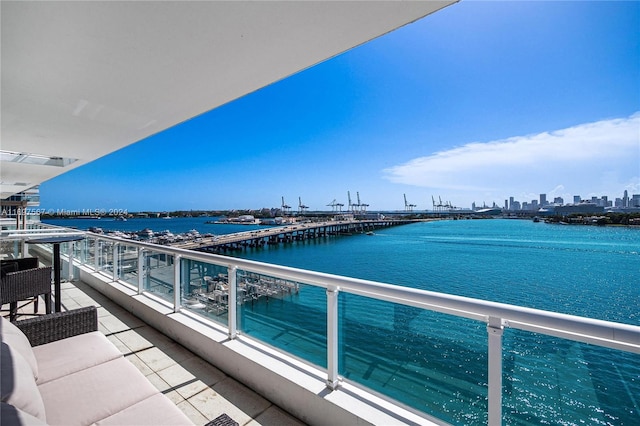 balcony featuring a water view