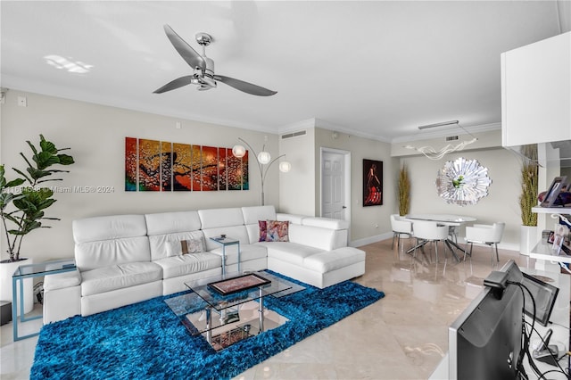 living room with ceiling fan and crown molding