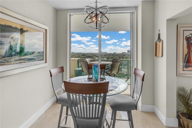 dining area featuring an inviting chandelier