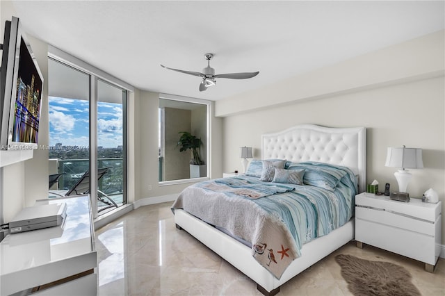 bedroom with ceiling fan, access to exterior, and a wall of windows