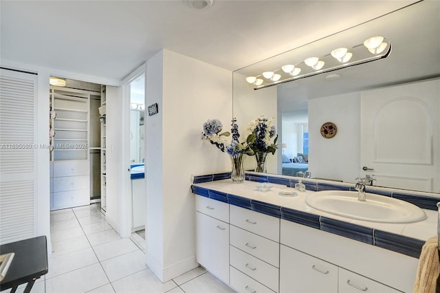 bathroom with vanity and tile patterned flooring