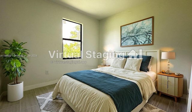 bedroom with hardwood / wood-style flooring