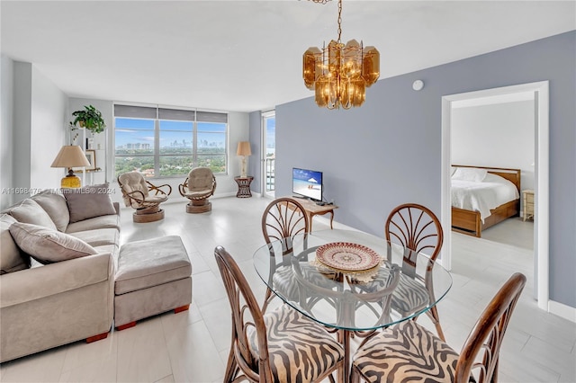 dining area with floor to ceiling windows and a chandelier