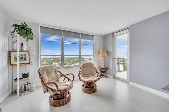 sitting room featuring a wall of windows