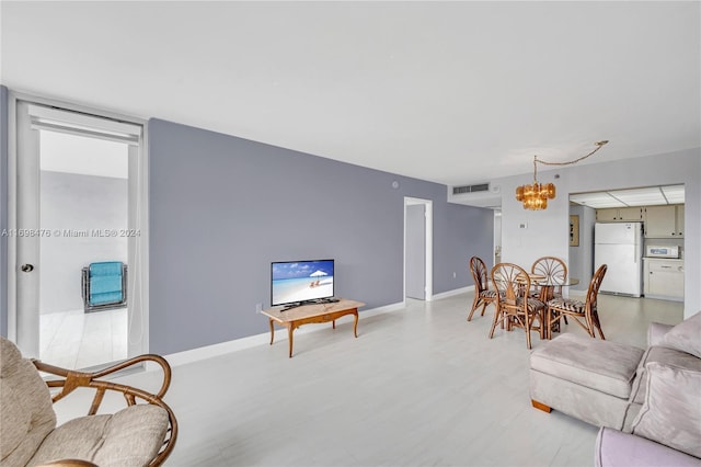 living room with a notable chandelier