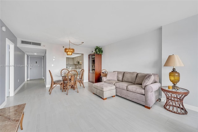 living room with a notable chandelier