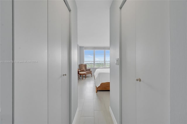 hallway with light tile patterned floors