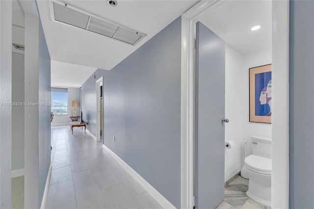 hallway with light tile patterned floors