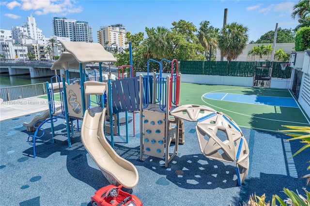 view of jungle gym featuring basketball court