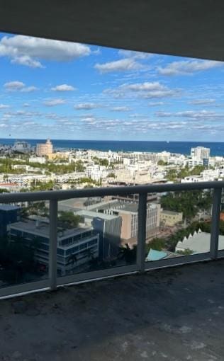 balcony featuring a water view