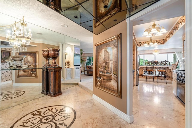 hallway with a notable chandelier and ornamental molding