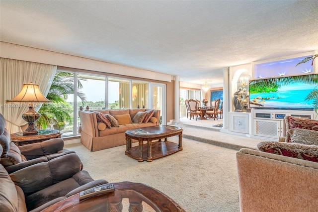 carpeted living room featuring a textured ceiling