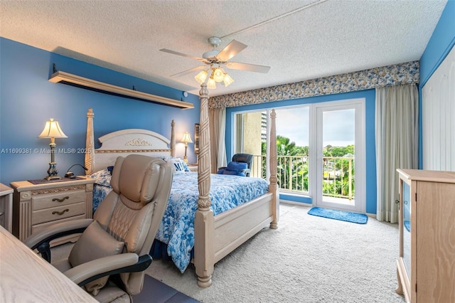 carpeted bedroom with ceiling fan, access to exterior, and a textured ceiling