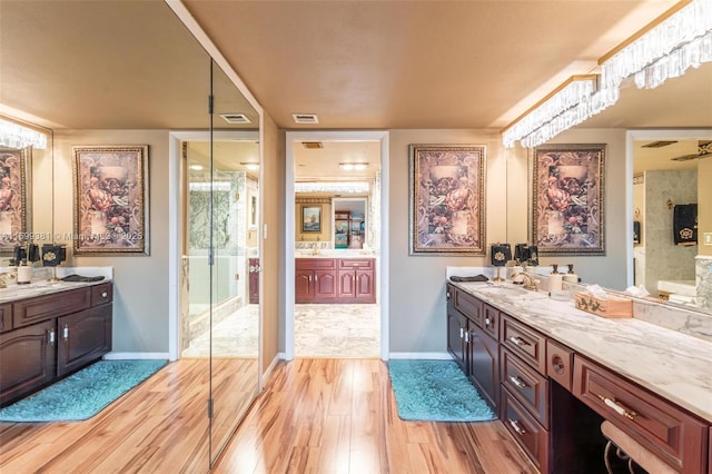 bathroom featuring vanity and wood-type flooring