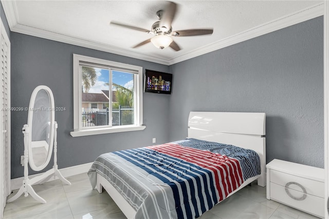 bedroom with ceiling fan and ornamental molding