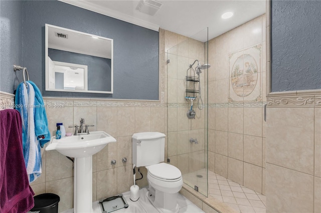 bathroom with toilet, tile walls, and walk in shower