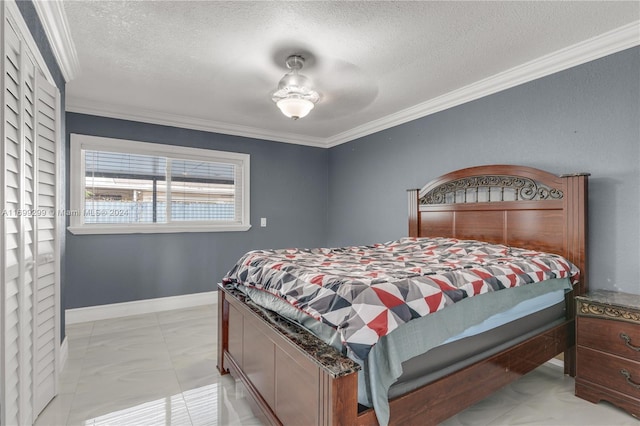 bedroom with a textured ceiling, ceiling fan, and ornamental molding