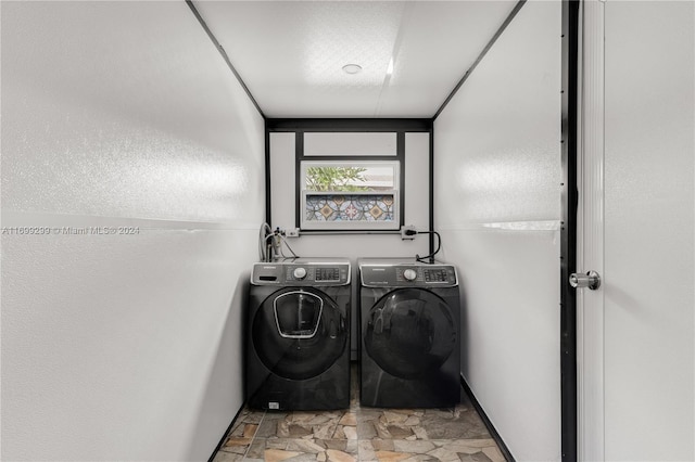 laundry area with washer and clothes dryer