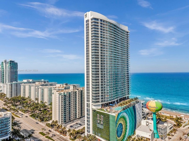 exterior space featuring a water view and a view of the beach