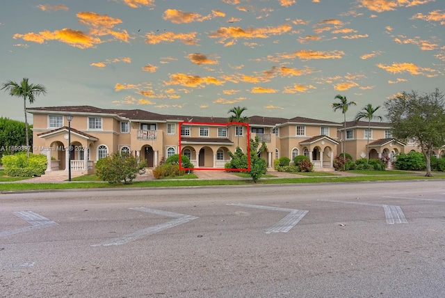 view of outdoor building at dusk