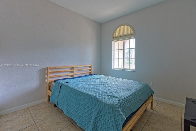 bedroom featuring tile patterned flooring