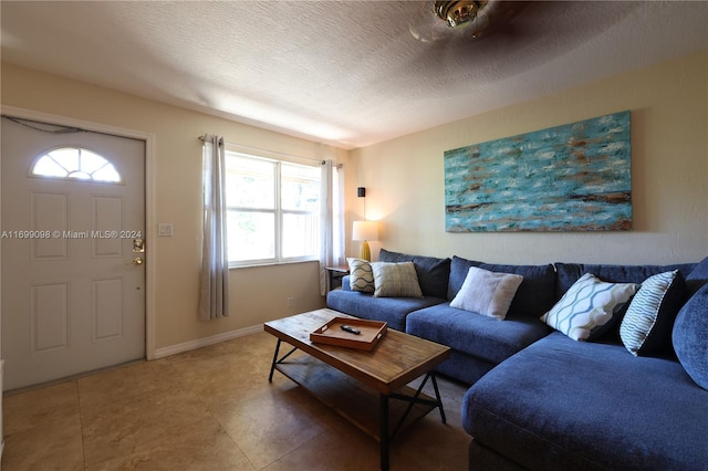 living room featuring a healthy amount of sunlight and a textured ceiling