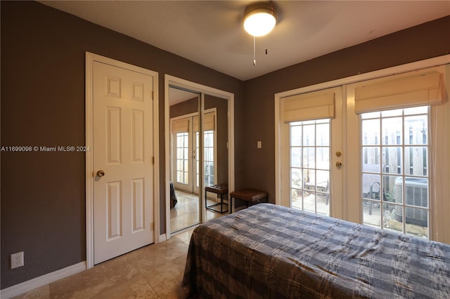 bedroom featuring french doors and ceiling fan