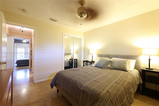 bedroom featuring ceiling fan and a closet