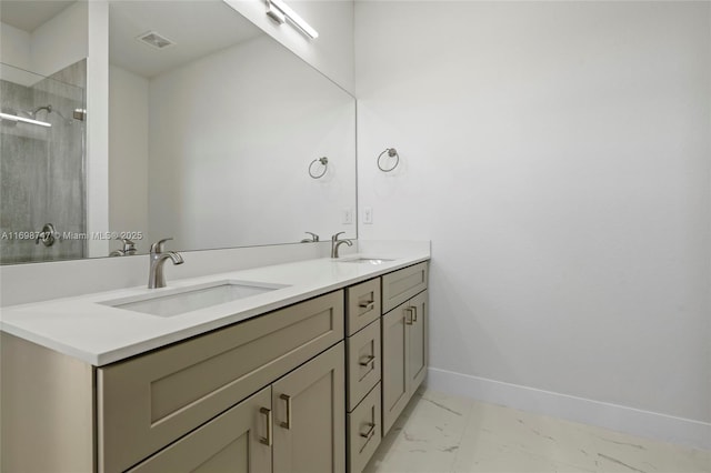 bathroom featuring vanity and a shower with shower door