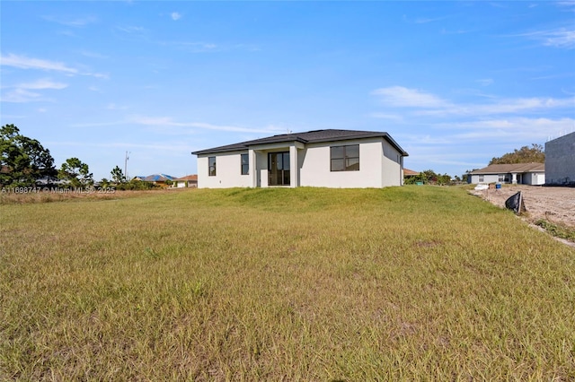 view of front of home with a front yard