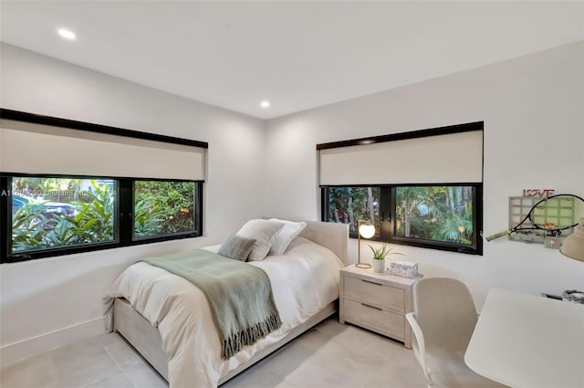 bedroom with light tile patterned floors