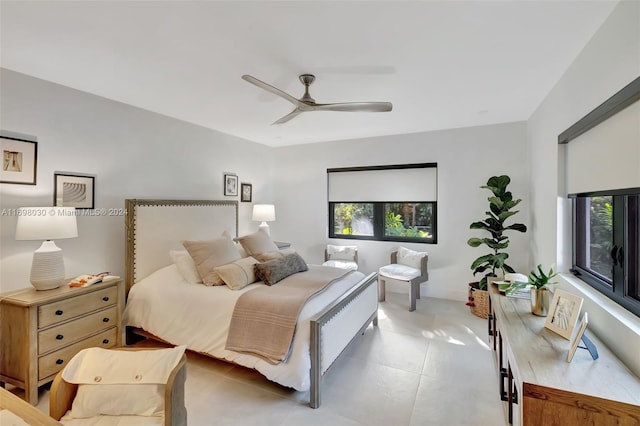 bedroom featuring tile patterned floors and ceiling fan