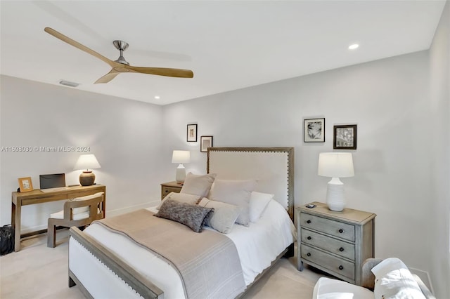 bedroom featuring light colored carpet and ceiling fan