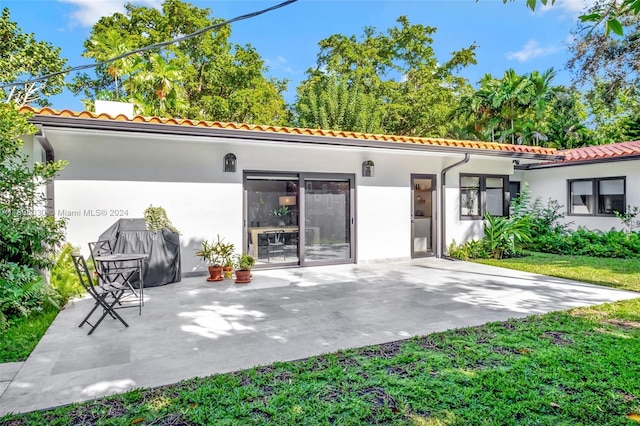 rear view of property with a patio